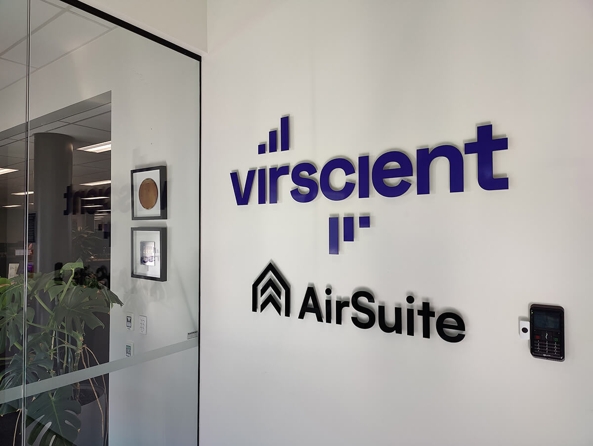 Office wall with Air Suite logo attached to it